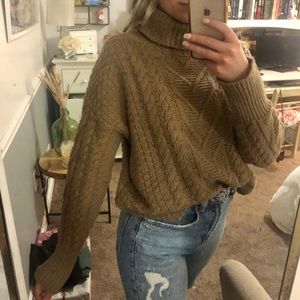 Brown cable knit turtleneck sweater with peplum